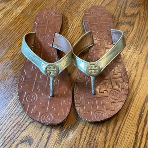 Tory Burch gold flip flop sandals